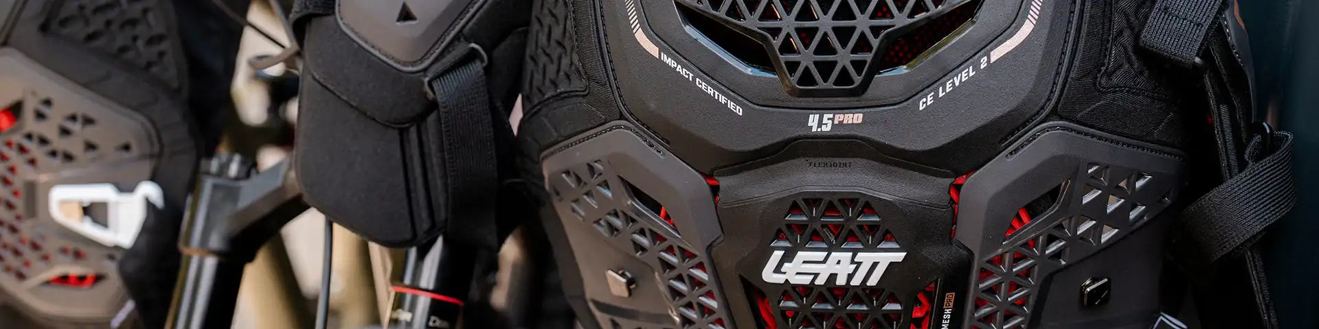 Black and red leatt 4.5 pro ce level 2 motorcycle chest protector with a geometric mesh design.